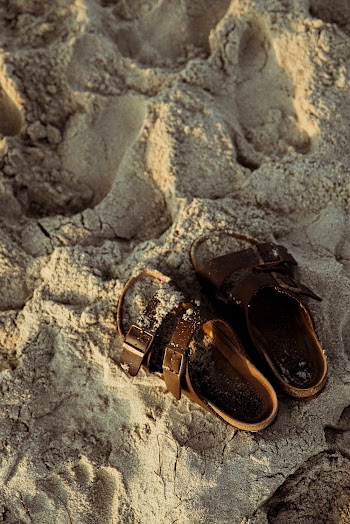 Brown Sandals On Sand
