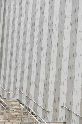 Brown Staircase Beside Grey Striped Concrete Wall