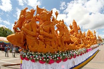 Brown Statues Under White Cloudy Sky