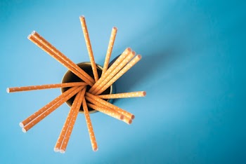 Brown Sticks in White Mug