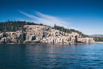 Brown Stone and Body of Water
