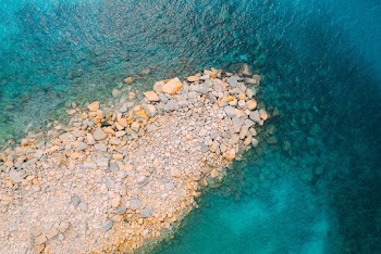 Brown Stones and Body of Water
