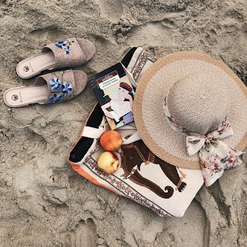 Brown Sun Hat And Sandals On Sand