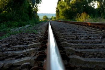 Brown Train Rail on Close Up Photo during Daytime