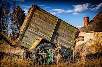 Brown Utility Trailer Near House
