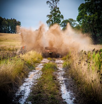 Brown Vehicle On Wet Soil 