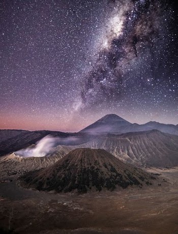 brown volcano under grey sky