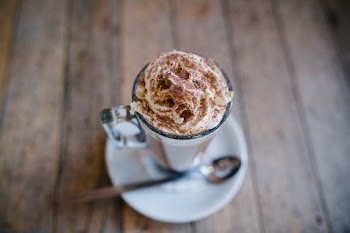 brown whip cream in clear glass cup
