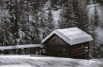 Brown Wooden Barn during Snow