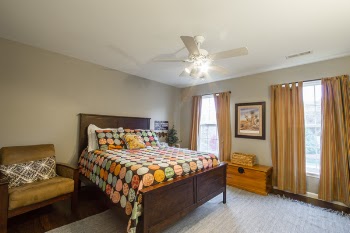 Brown Wooden Bed Under Ceiling Fan