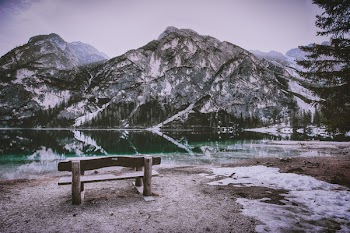 Brown Wooden Bench Near Mountain Hill
