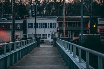 Brown Wooden Bridge Across Body of Water
