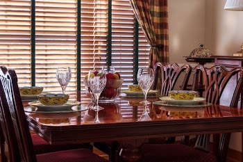 Brown Wooden Chair Near Short Stem Clear Wine Glass