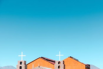 brown wooden church under blue sky during daytime