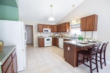 Brown Wooden Dining Set Inside Kitchen