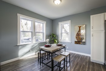 Brown Wooden Dining Set Under White Ceiling Lamp Beside Window and Door