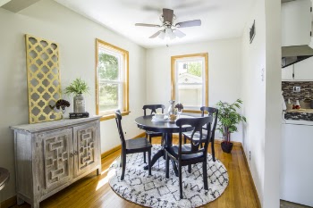 Brown Wooden Dining Table and Chairs on Area Rug