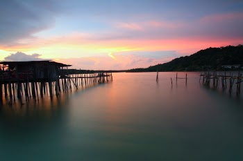 Brown Wooden Dock and Sea during Sunset