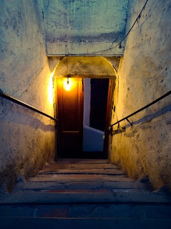 Brown Wooden Door Near Concrete Stairs With Light