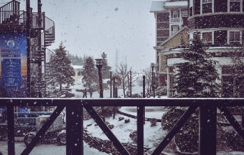 Brown Wooden Fence and Building in Winter Time