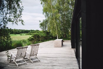 Brown Wooden Folding Chairs on a Porch