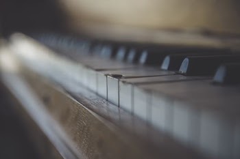 brown wooden framed piano