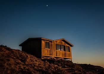 brown wooden house in top of mountain
