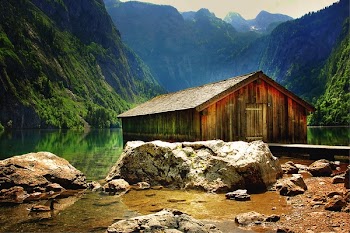 Brown Wooden House Near at Body of Water