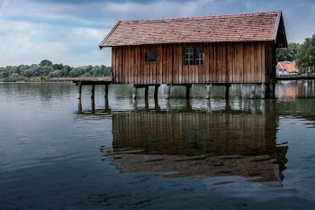 Brown Wooden House on River
