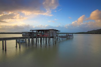 Brown Wooden House on Water