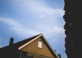 Brown Wooden House Under Blue Sky at Daytime
