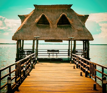 Brown Wooden Hut On Pier