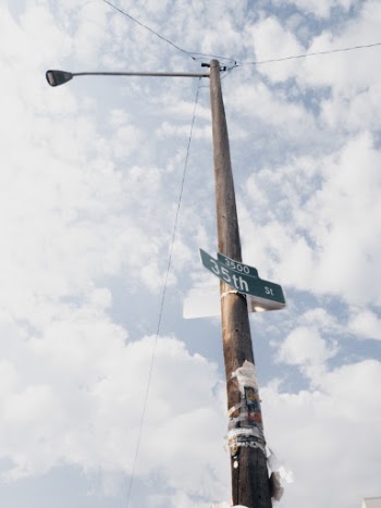 Brown Wooden Lamp Post Under White and Blue Skies