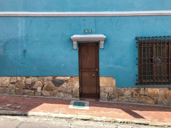 Brown Wooden Shut Door Beside Empty Sidewalk