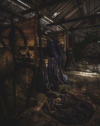 Brown Wooden Storage With Blue Cloth in Room