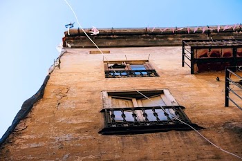 brown wooden window closed under blue sky during daytime