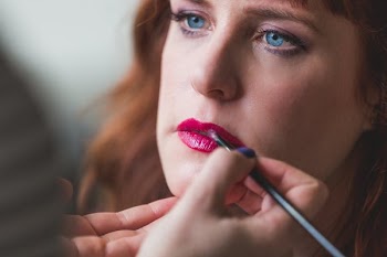 Brushing On Red Lipsick