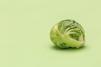 Brussel Sprout On Green Surface