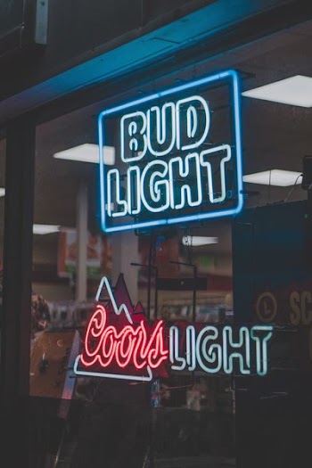 Bud Light above Coors Light neon signages