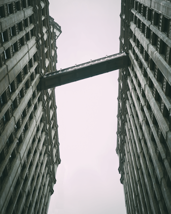 Building Bridge Under Gray Sky