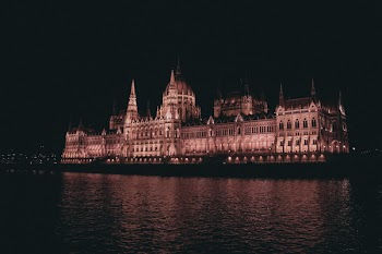 Building In Front Of Calm Body Of Water