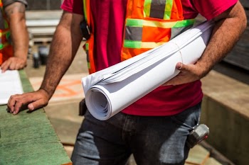 Building Plans In Hand