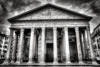 Building With 8 Concrete Pillar in Front Grayscale Photo
