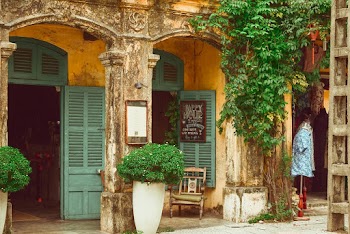 Building With Green Opened Doors and Windows