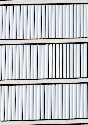 Building with White Window Blinds in Close-up Photo