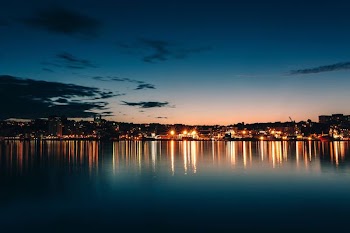 buildings and body of water