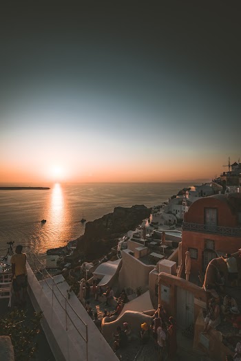 Buildings Near Body of Water during Sunset