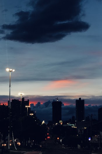 Buildings Under Blue Sky during Golden Hour With Lights