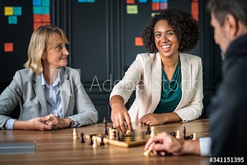 Buiness friends playing a game of chess