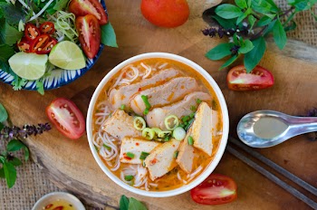 Bun rieu - A vietnamese noodle soup with tomato broth, shrimp and crab paste, tamarind, and eggs